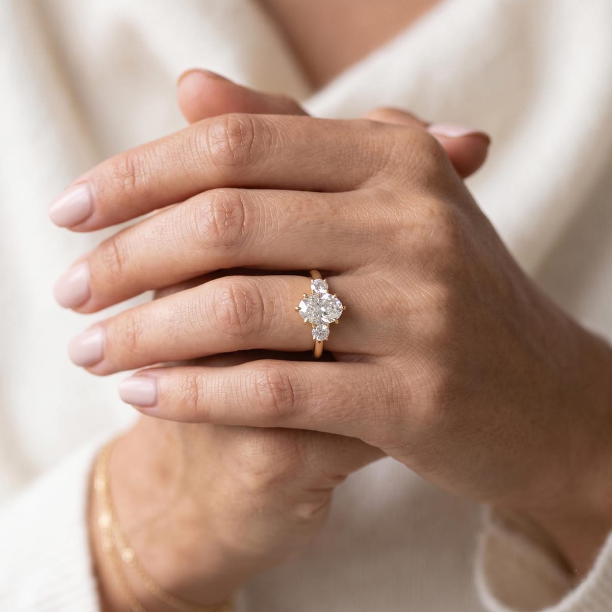 Oval-cut three-stone engagement ring, 1.9 ct