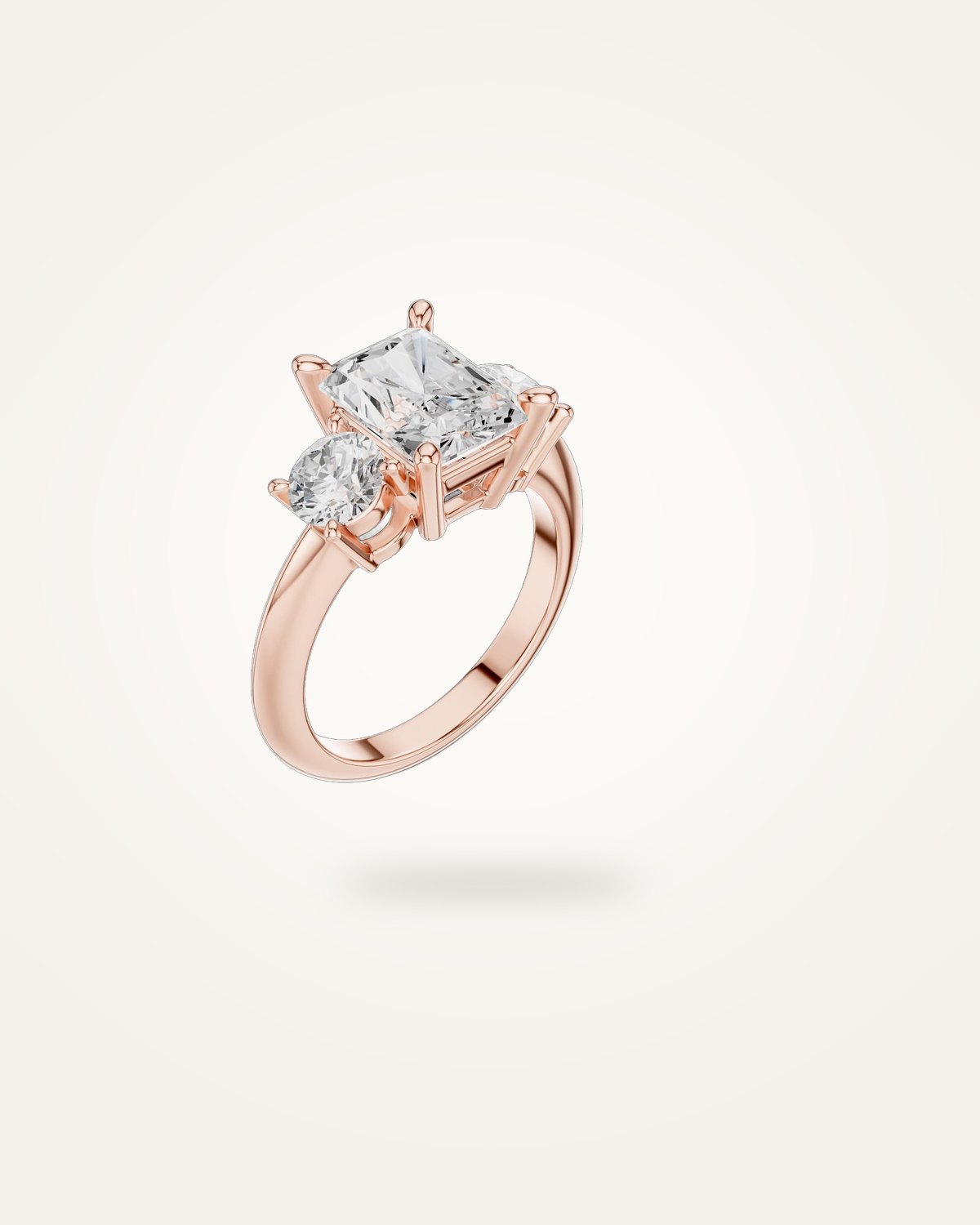 Radiant-cut three-stone engagement ring