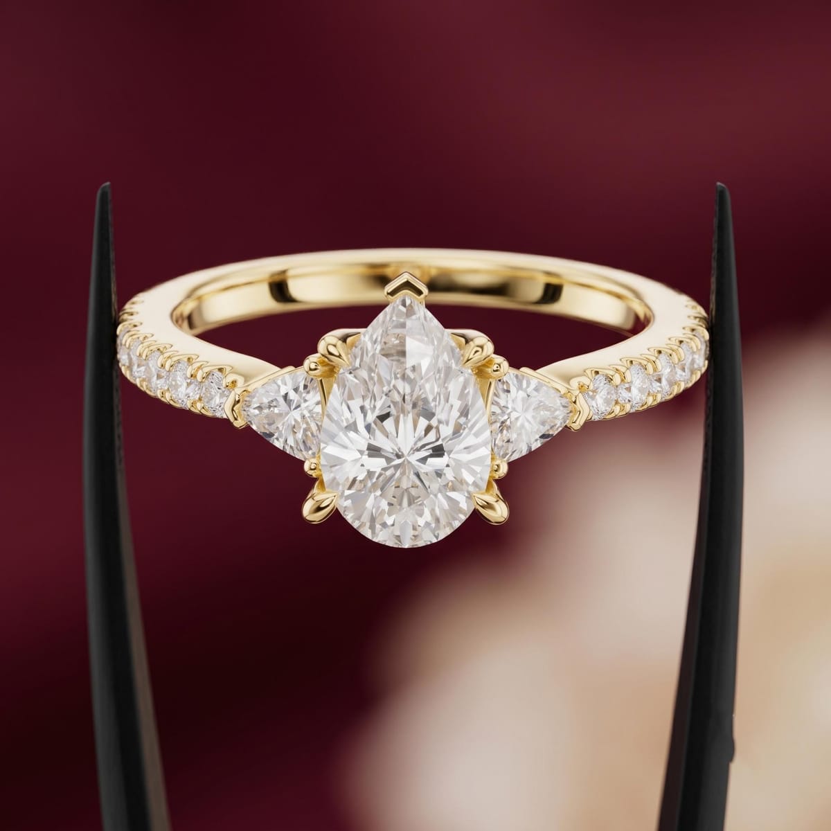 Pear-cut three-stone engagement ring
