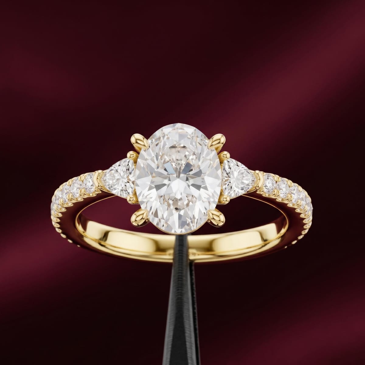 Oval-cut three-stone engagement ring, 1.96 ct