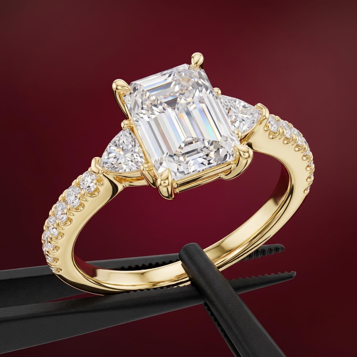 Emerald-cut three-stone engagement ring