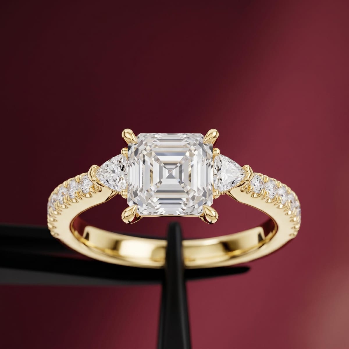 Asscher-cut three-stone engagement ring