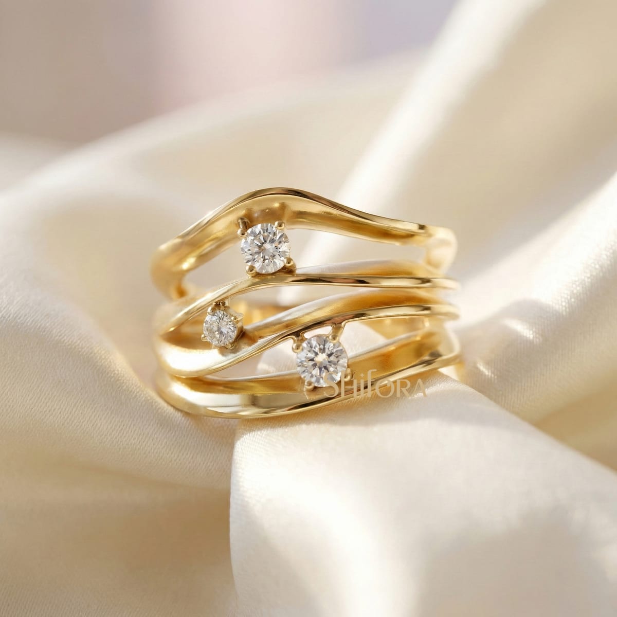 Abstract wave ring with three diamonds